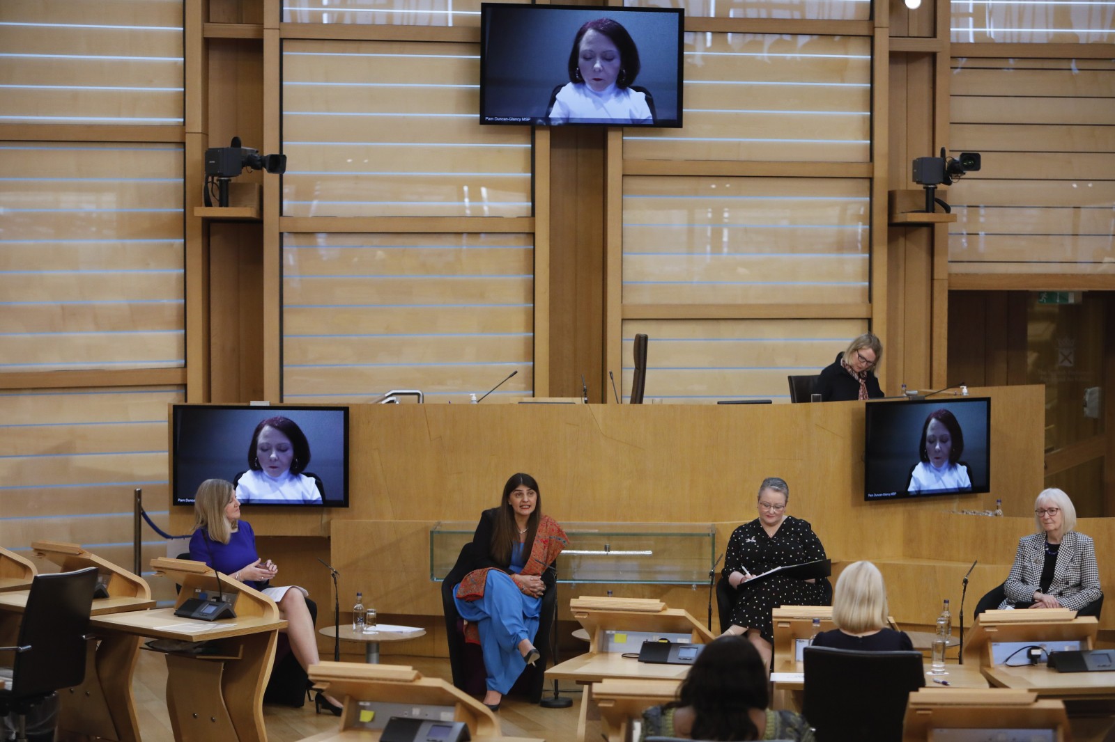 Presiding Officer Alison Johnstone MSP hosts a question and answer session with Pam Gosal MSP;Pam Duncan-Glancy MSP; Christina McKelvie MSP; and Beatrice Wishart MSP during the International Women's Day Conference held in the Debating Chamber of the Scottish Parliament. 05 March 2022.