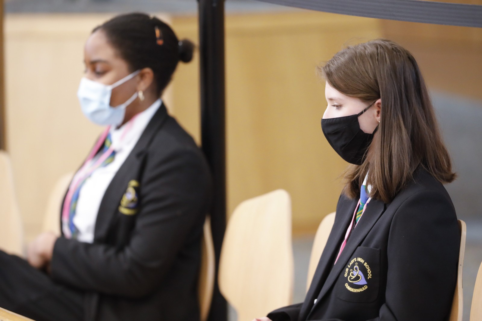 Participants look on during keynote speeches during the International Women's Day Conference held in the Debating Chamber of the Scottish Parliament. 05 March 2022.