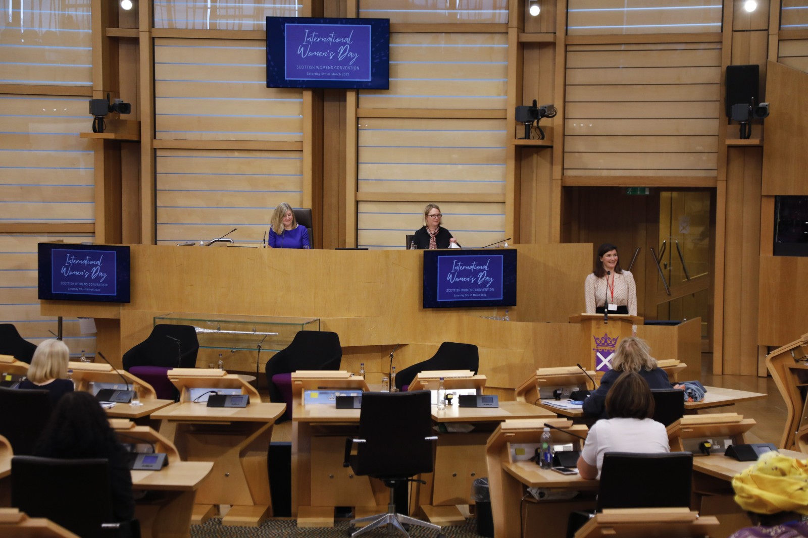 Actor Carmen Pieraccini making her keynote address during the International Women's Day Conference held in the Debating Chamber of the Scottish Parliament. 05 March 2022.
