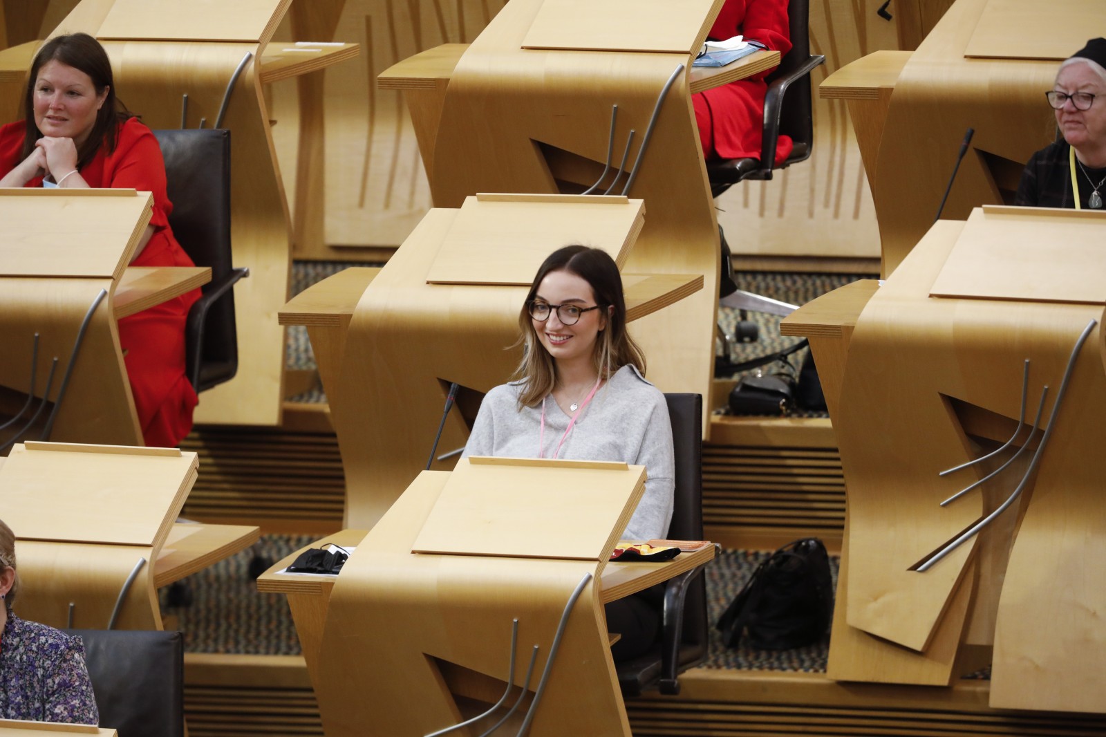 Participants look on during keynote speeches during the International Women's Day Conference held in the Debating Chamber of the Scottish Parliament. 05 March 2022.