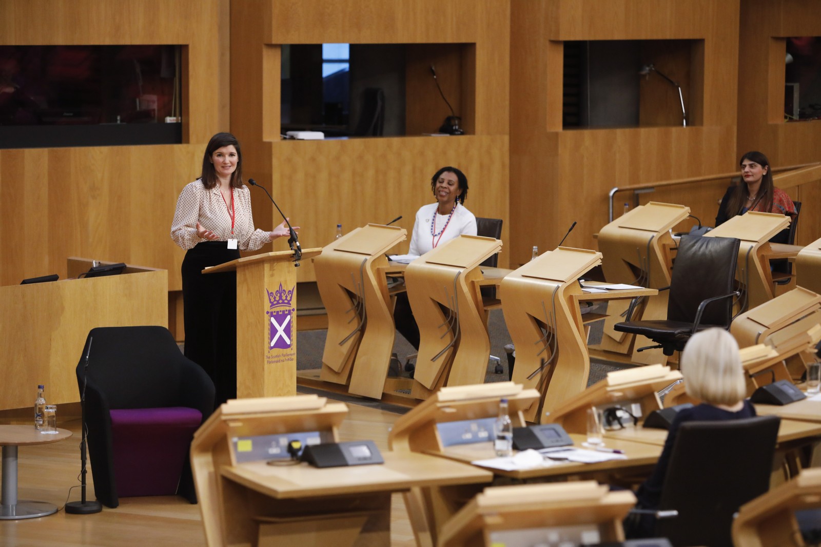 Actor Carmen Pieraccini making her keynote address during the International Women's Day Conference held in the Debating Chamber of the Scottish Parliament. 05 March 2022.