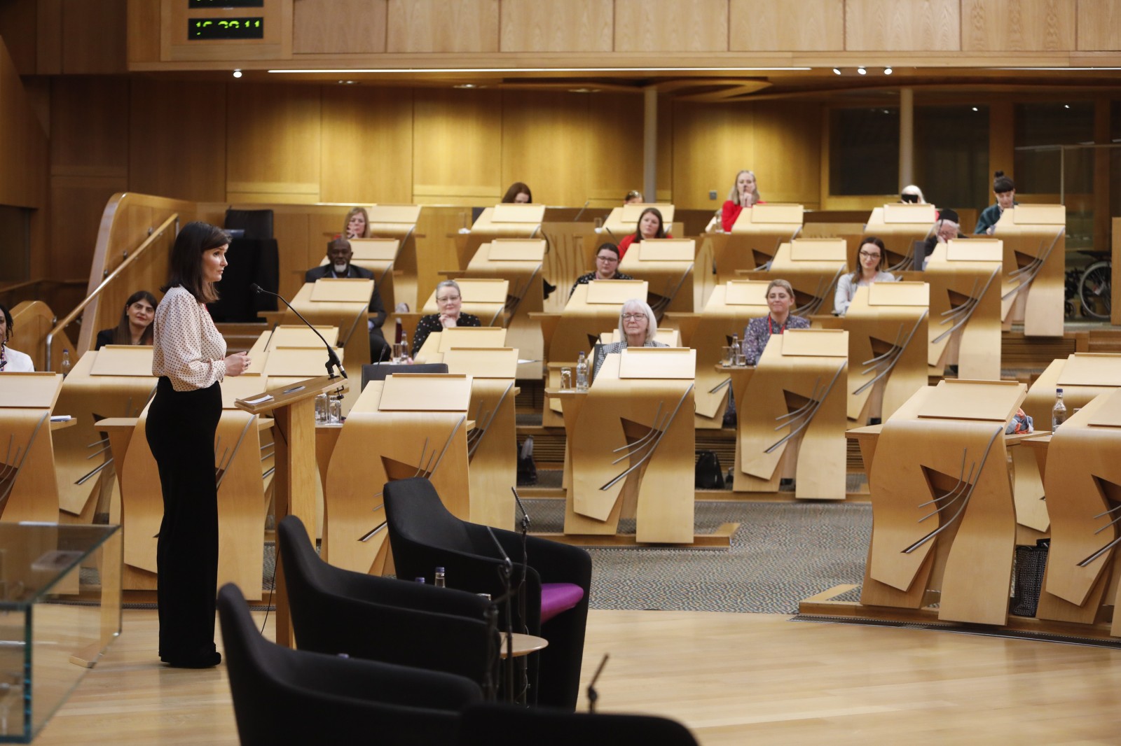 Actor Carmen Pieraccini making her keynote address during the International Women's Day Conference held in the Debating Chamber of the Scottish Parliament. 05 March 2022.