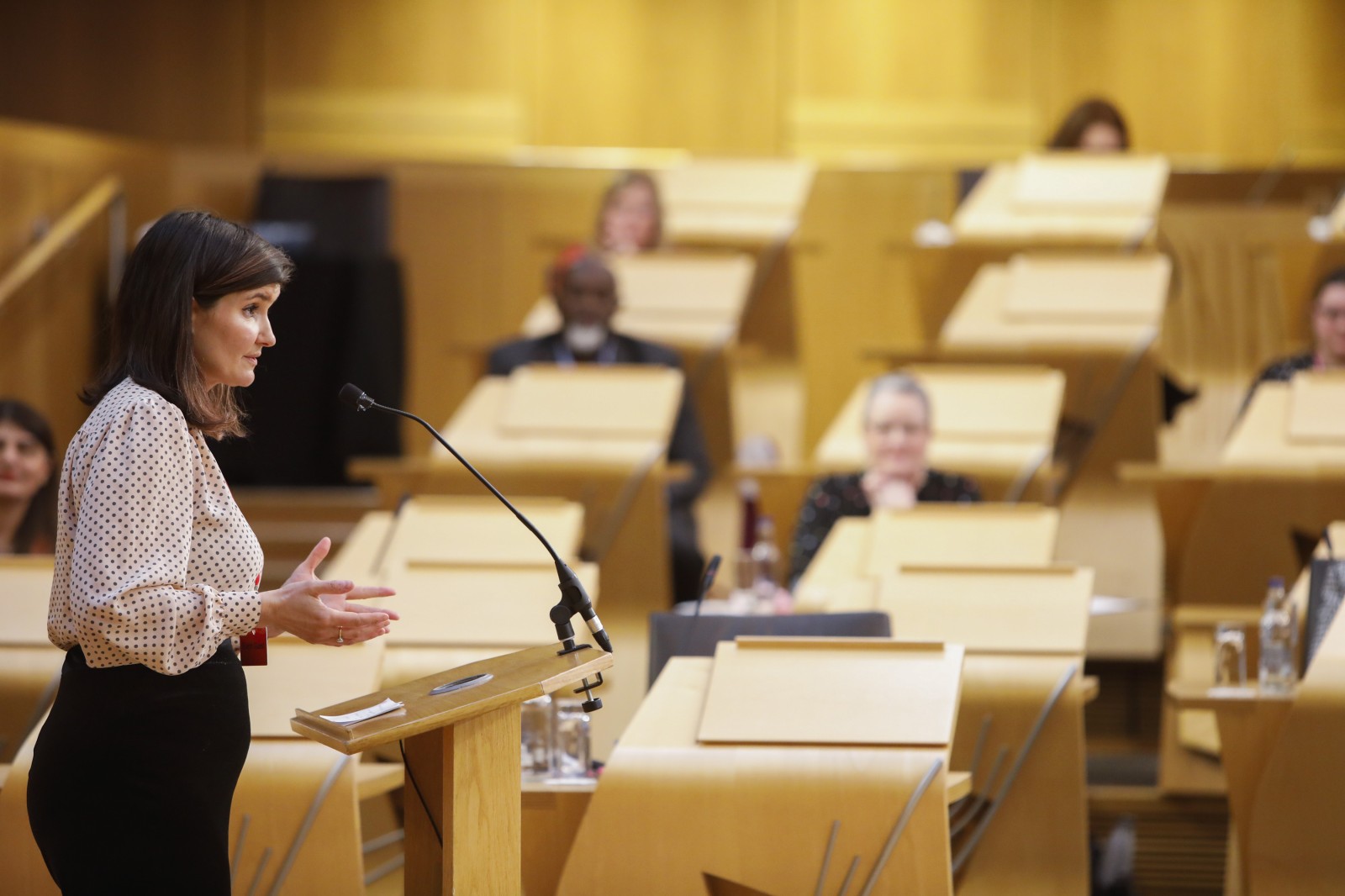 Actor Carmen Pieraccini making her keynote address during the International Women's Day Conference held in the Debating Chamber of the Scottish Parliament. 05 March 2022.