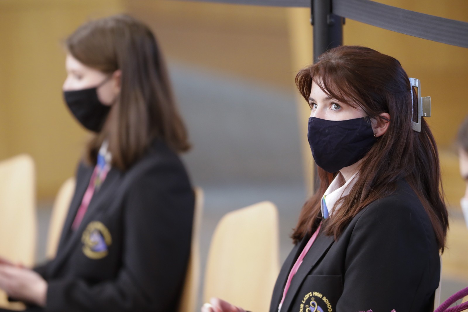 Participants look on during keynote speeches during the International Women's Day Conference held in the Debating Chamber of the Scottish Parliament. 05 March 2022.