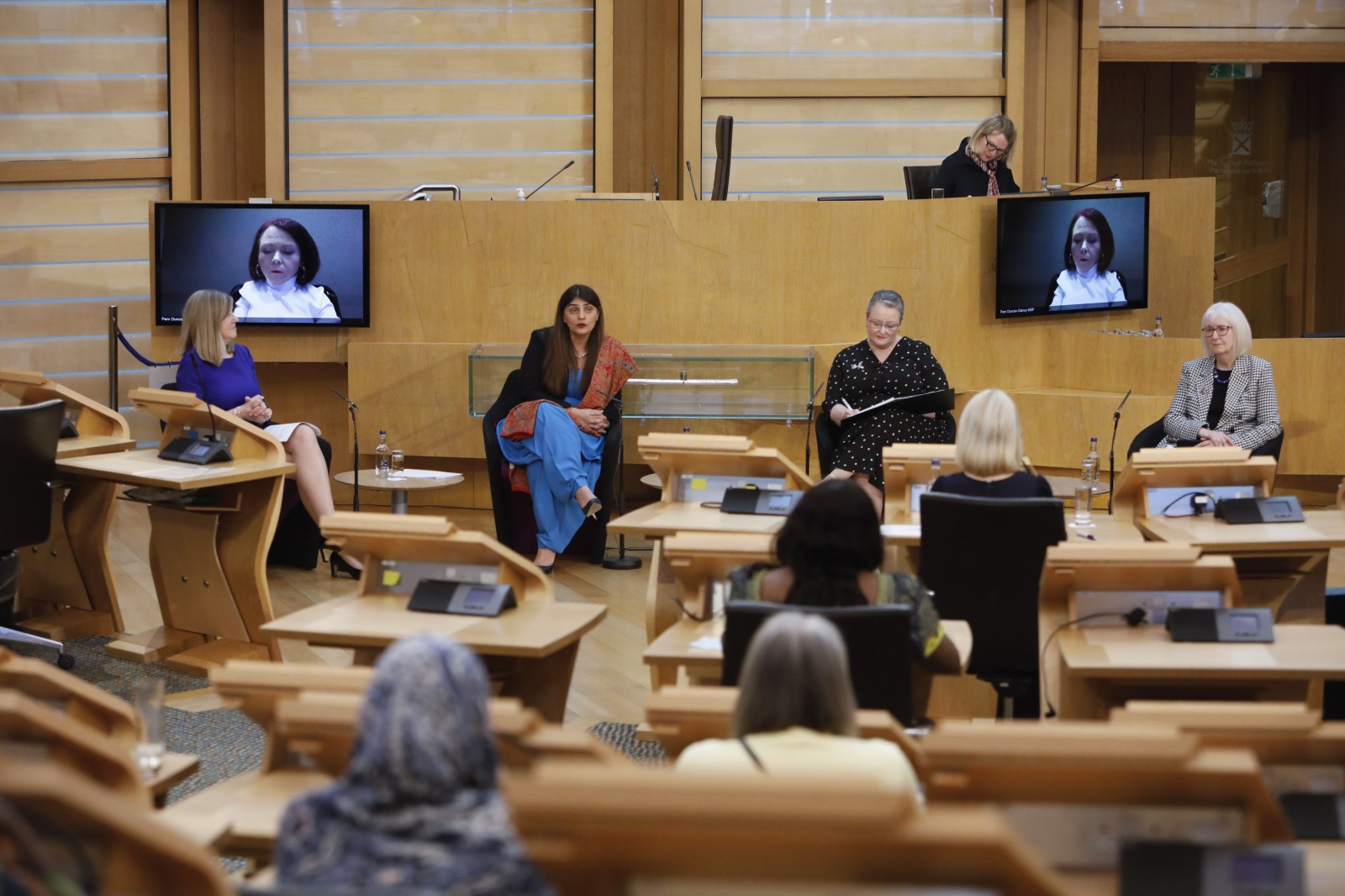 Presiding Officer Alison Johnstone MSP hosts a question and answer session with Pam Gosal MSP;Pam Duncan-Glancy MSP; Christina McKelvie MSP; and Beatrice Wishart MSP during the International Women's Day Conference held in the Debating Chamber of the Scottish Parliament. 05 March 2022.