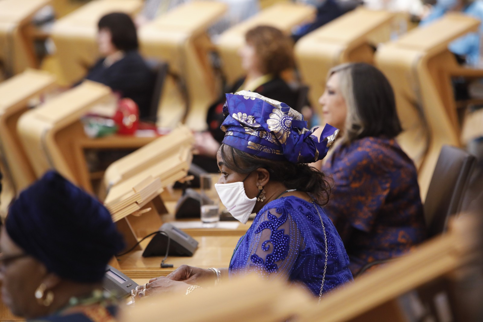 Participants look on during keynote speeches during the International Women's Day Conference held in the Debating Chamber of the Scottish Parliament. 05 March 2022.