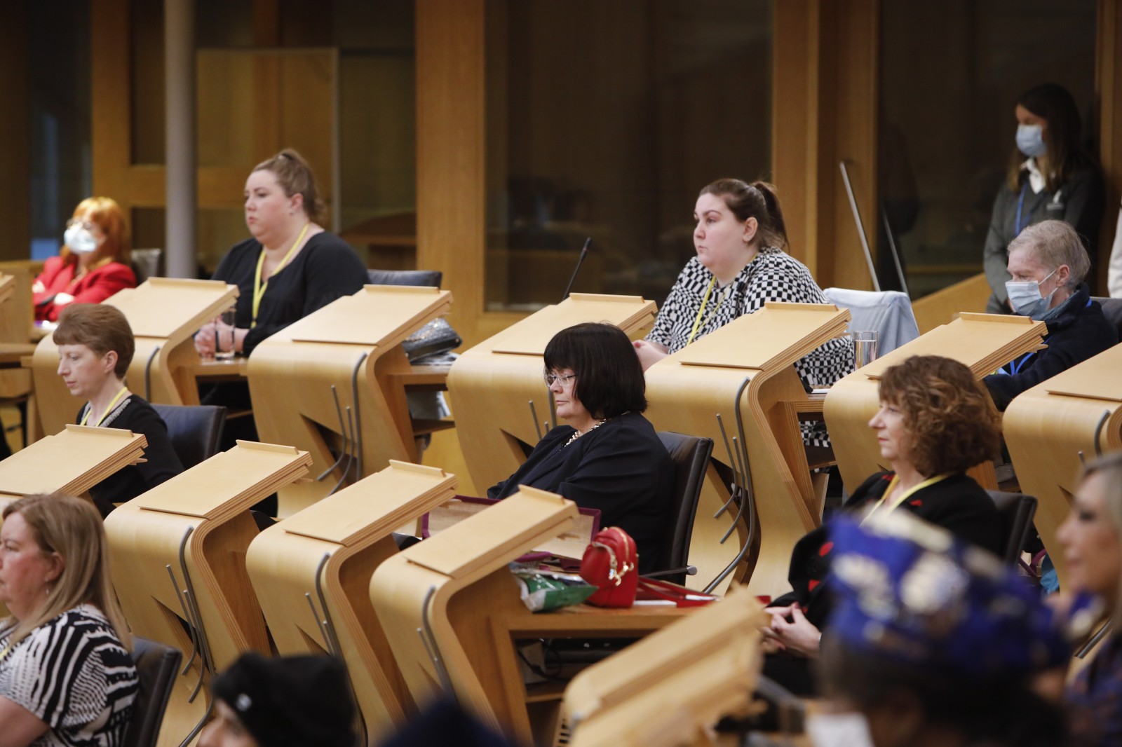 Participants look on during keynote speeches during the International Women's Day Conference held in the Debating Chamber of the Scottish Parliament. 05 March 2022.