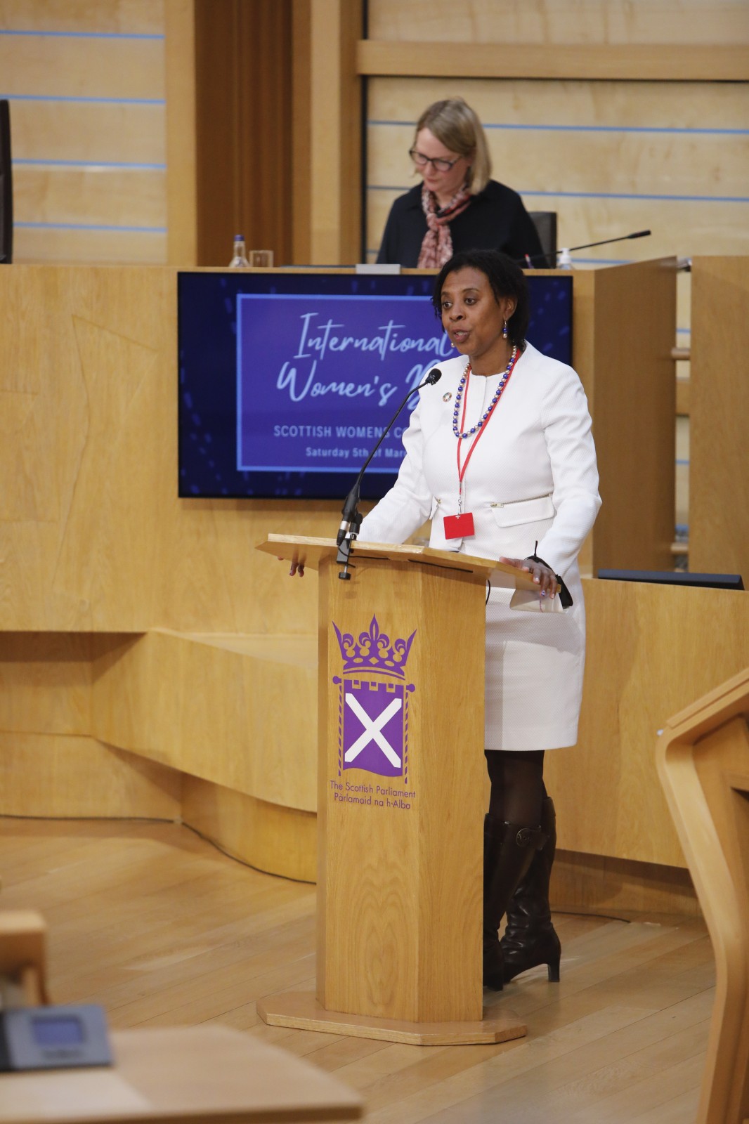 Brenda King MBE making her keynote address during the International Women's Day Conference held in the Debating Chamber of the Scottish Parliament. 05 March 2022.