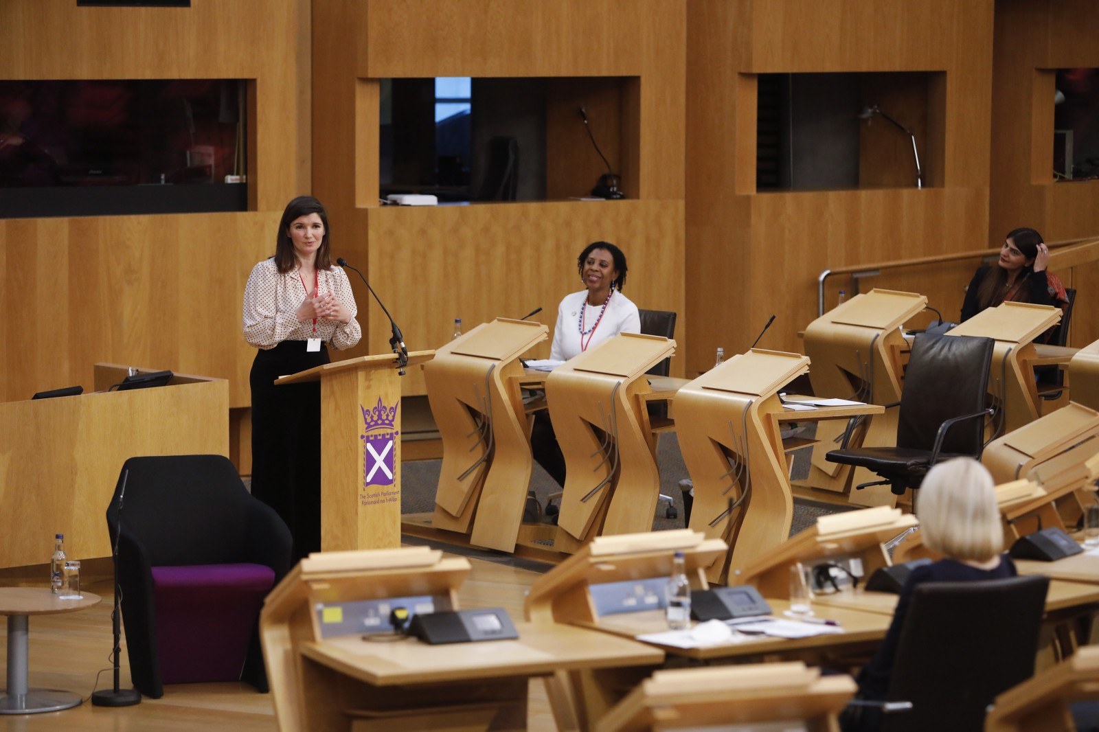 Actor Carmen Pieraccini making her keynote address during the International Women's Day Conference held in the Debating Chamber of the Scottish Parliament. 05 March 2022.